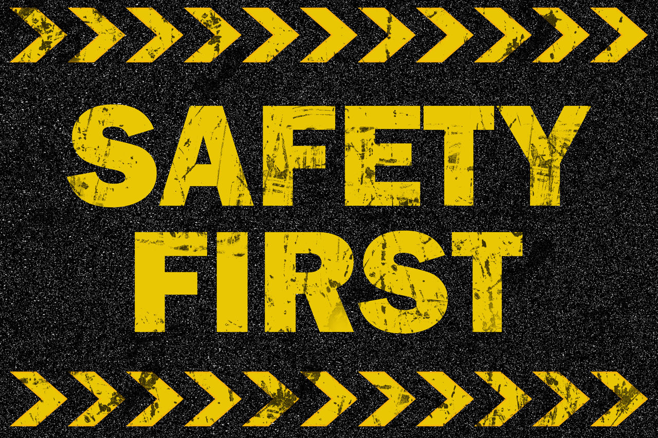 Safety first word on grunge background